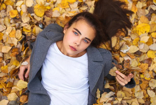 Top view portrait of a young beautiful woman in a white sweater — Stock Photo, Image