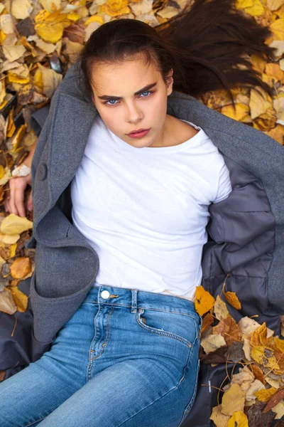 Top view portrait of a young beautiful woman in a white sweater — Stock Photo, Image