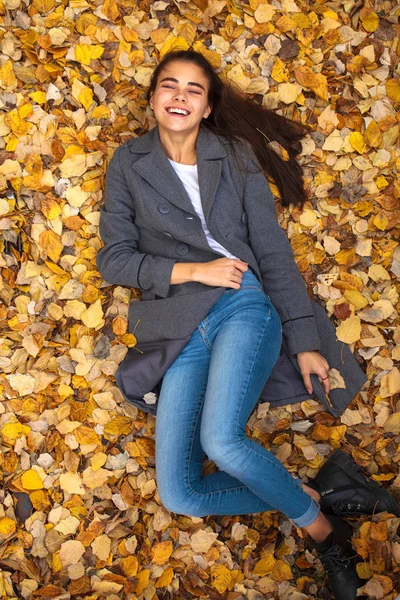 Top view portrait of a young beautiful woman in a white sweater — Stock Photo, Image