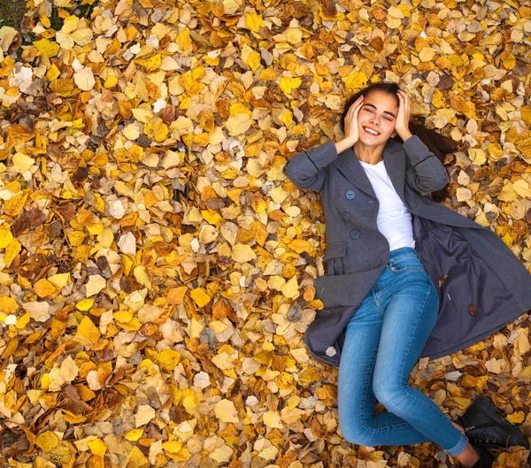 Top view portrait of a young beautiful woman in a white sweater — Stock Photo, Image