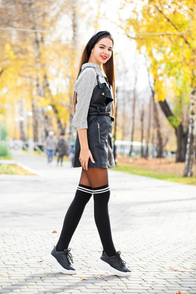 Portrait of a young beautiful woman in black dress — Stock Photo, Image