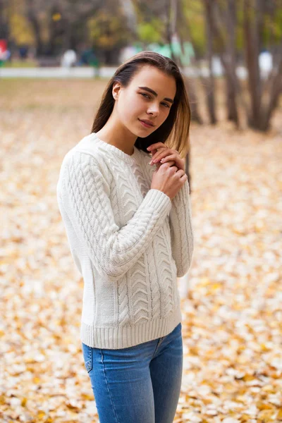 Close up portrait of a young beautiful girl in a white woolen sw — Stock Photo, Image