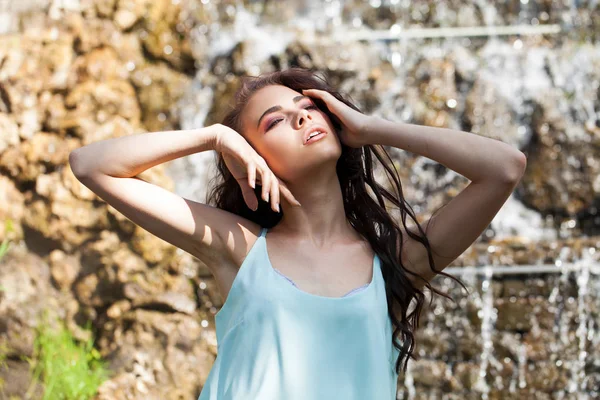 Young brunette model in turquoise blouse — Stock Photo, Image