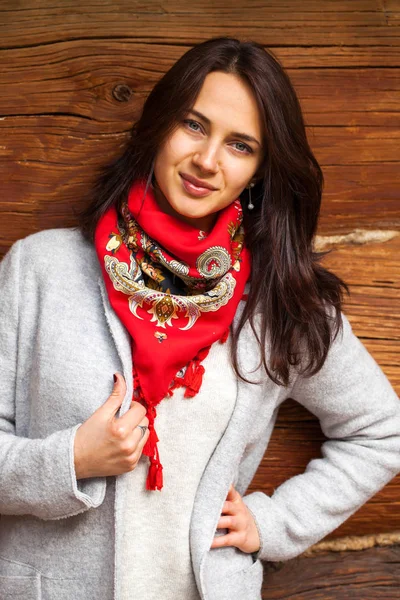 Portrait of a young beautiful woman with a red handkerchief — Stock Photo, Image