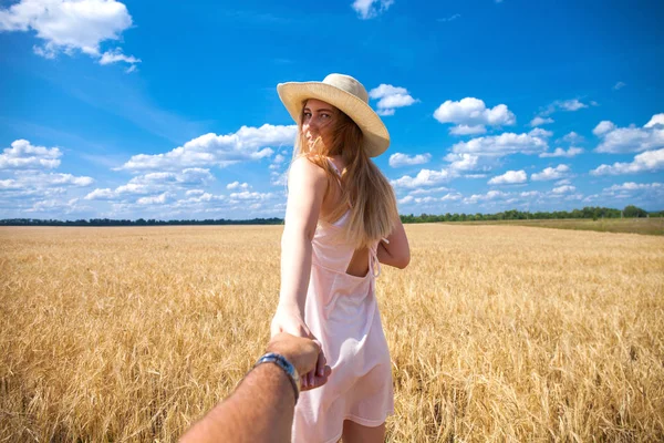 Come with me, young beautiful girl holds the hand of a man in a — Stock Photo, Image