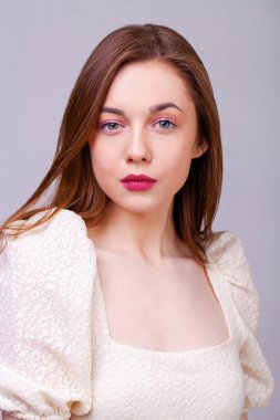 Make up beauty female face. Close up portrait of a young beautiful brunette model, isolated on white background