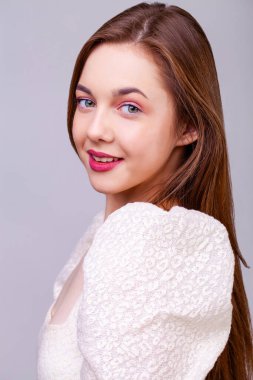 Make up beauty female face. Close up portrait of a young beautiful brunette model, isolated on white background