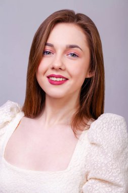 Make up beauty female face. Close up portrait of a young beautiful brunette model, isolated on white background