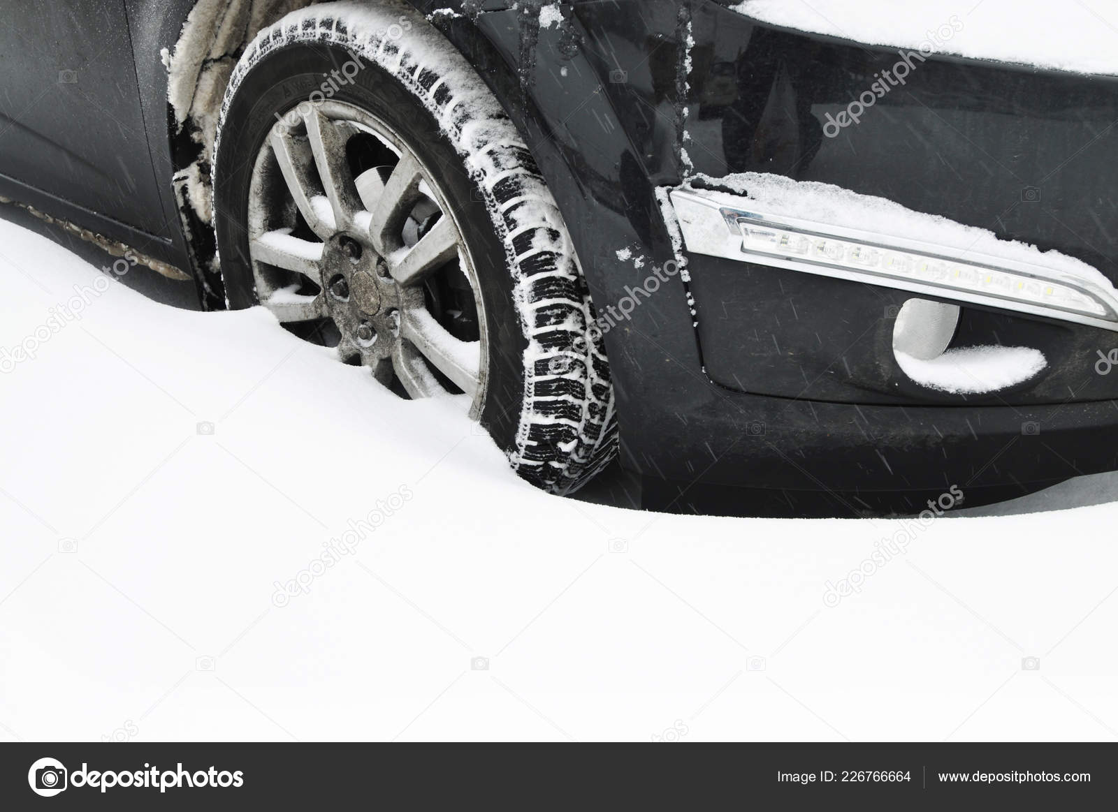 Car Front Wheel Stuck White Snow Parking Lot — Stock Photo © jonson 226766664