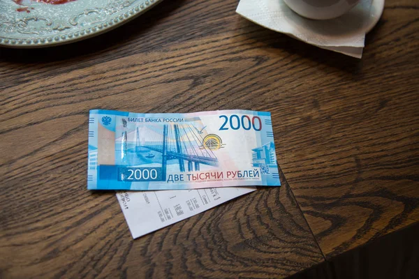 New 2000 rubles banknote in cafe — Stock Photo, Image