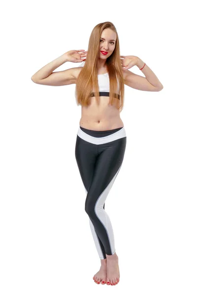 Giovane donna attraente posa in fitnes usura — Foto Stock