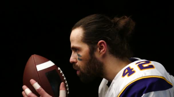 Close up portrait of American Football Player with ball — Stock Video