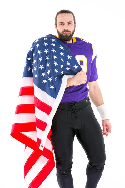 Brodaty amerykański piłkarz z Flaga narodowa, portret. — Zdjęcie stockowe