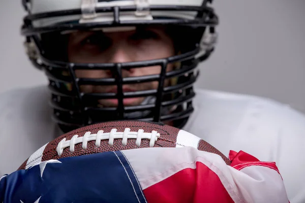 Bearded American football ball with national flag.