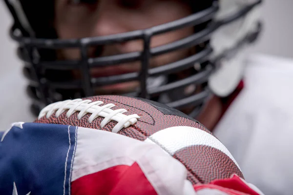 Bearded American football ball with national flag.