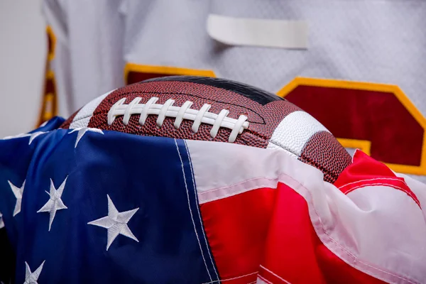 American football ball with national flag.