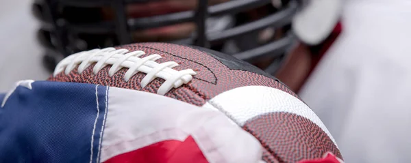 Bearded American football ball with national flag.