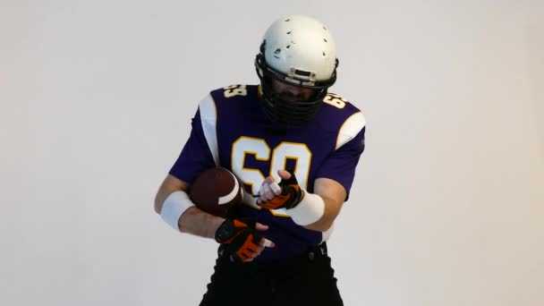 American Football Player wearing his sport dress on Black Background — Stock Video