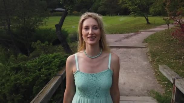 Young Caucasian Blonde Woman Walk In Park. — Stock Video