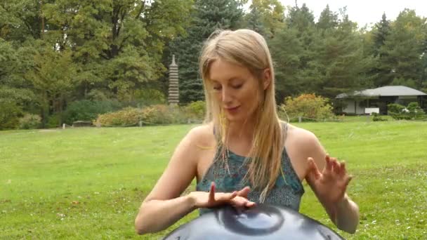 Woman Playing The Hang outdoors. — Stock Video