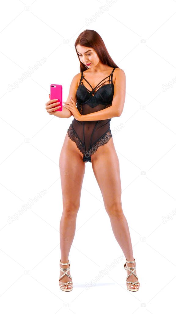 Pretty brunette girl make selfie by her smartphone