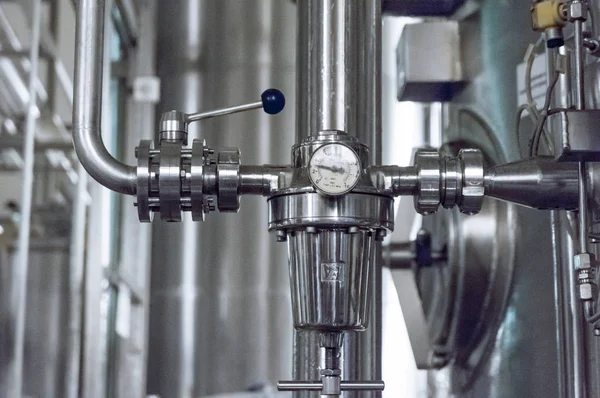 Industrial pressure meter - barometer and water pipes in the background — Stock Photo, Image