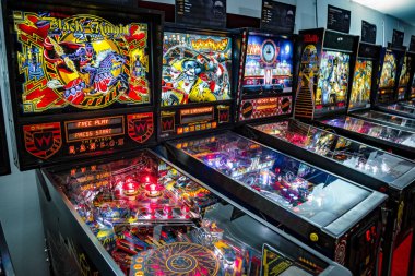 Budapest, Hungary - March 25, 2018: Pinball museum. Pinball table close up view of vintage machine. clipart
