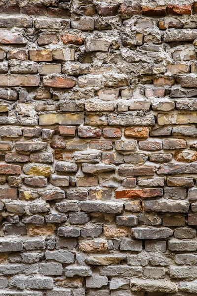 Pozadí staré vinobraní špinavé cihlové zdi s oloupanou omítkou, textura — Stock fotografie