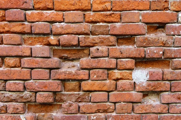 Background of old vintage dirty brick wall with peeling plaster, texture — Stock Photo, Image