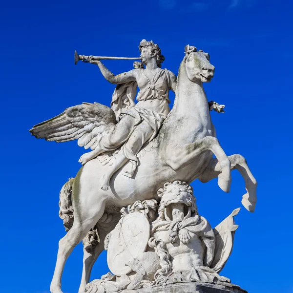 Paris, France, March 28 2017: This sculpture is located in the Tuileries Garden in Paris. It depicts the god Mercury as a young man sitting sidesaddle on Pegasus — Stock Photo, Image