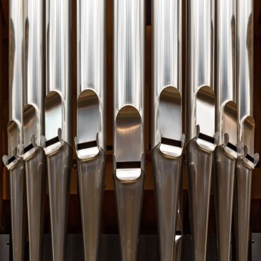 Close-up of modern steel organ pipe clipart