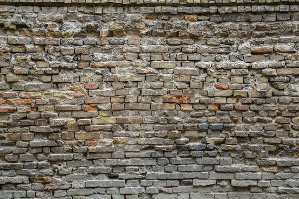 Sfondo del vecchio muro di mattoni sporchi vintage con intonaco peeling, texture — Foto Stock