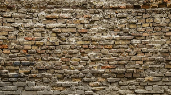 Sfondo del vecchio muro di mattoni sporchi vintage con intonaco peeling, texture — Foto Stock