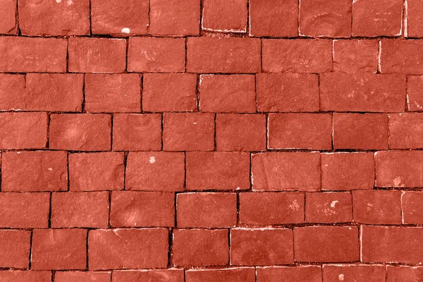 Pared de piedra hecha con cuadrados. Living Coral Color del año 2019. Concepto de tendencia principal —  Fotos de Stock