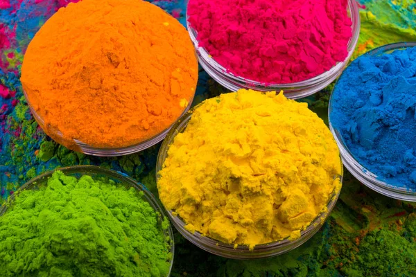 Holi color powder. Organic Gulal colours in bowl for Holi festival, Hindu tradition festive. Bright vibrant pigment closeup — Stock Photo, Image