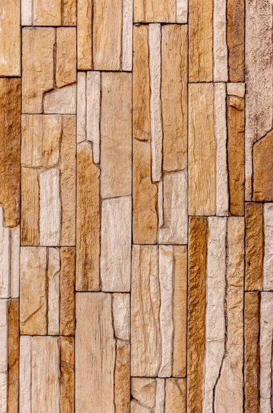 Bergvägg sten tegel kakel har en detaljerad bakgrund textur sepia grädde brun färg staplade i lager, kan du använda bilden som bakgrundsbild med en textur bild — Stockfoto