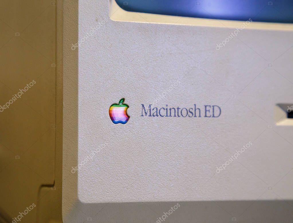 Istanbul, Turkey, March 2019: Closeup old rainbow Apple logo on old Macintosh computer. Rahmi Koc museum.