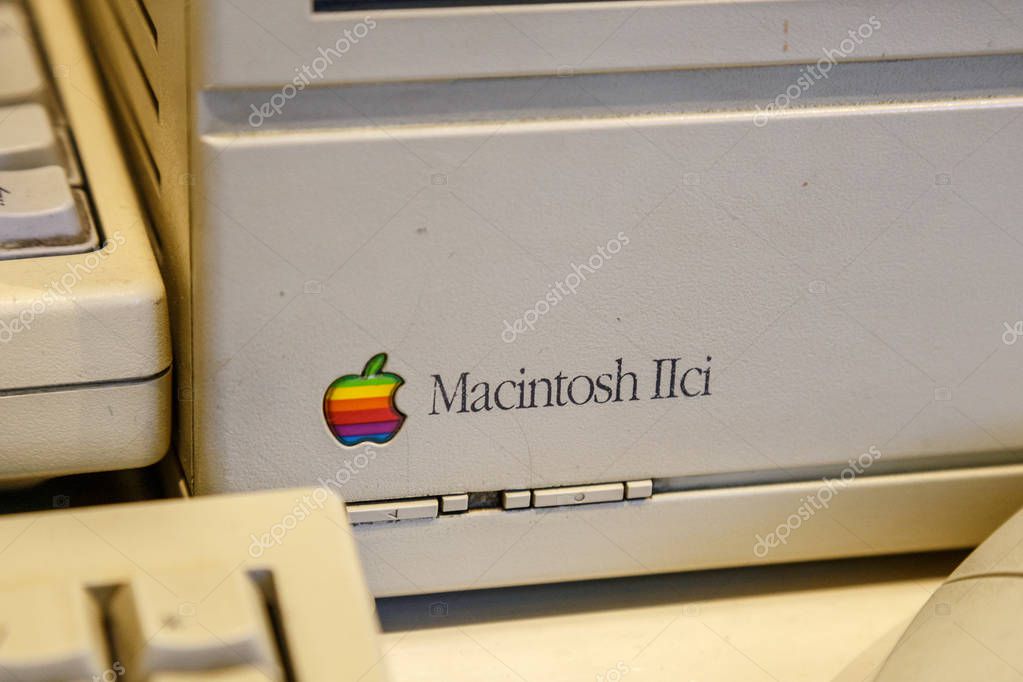 Istanbul, Turkey, March 2019: Closeup old rainbow Apple logo on old Macintosh computer. Rahmi Koc museum.