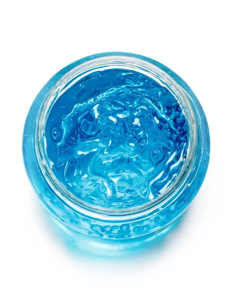 Blå gel behållaren isolerad på vit bakgrund från översta vyn. Transparent gel med bubblor i närbild — Stockfoto