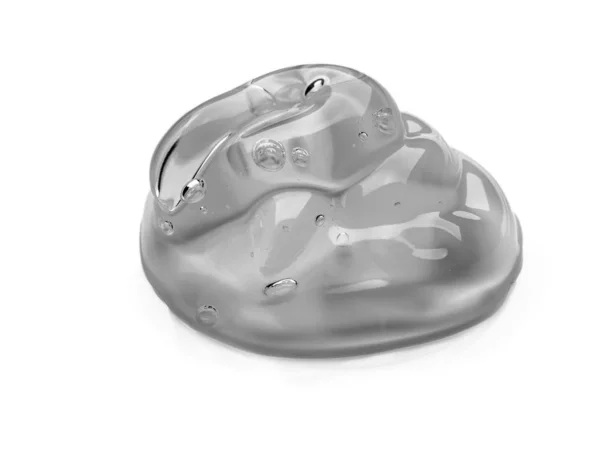 Πιεσμένη καλλυντική διάφανη υφή κρέμας gel Iisolated σε λευκό φόντο. Κοντινό πλάνο φωτογραφία της διαφανούς σταγόνα του προϊόντος φροντίδας του δέρματος. Υψηλής ποιότητας διαφανές τζελ με φυσαλίδες closeup σε λευκό φόντο — Φωτογραφία Αρχείου