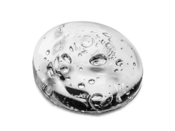 Squeezed cosmetic clear cream gel texture Iisolated on white background. Close up photo of transparent drop of skin care product. High Quality transparent gel with bubbles closeup on white background — Stock Photo, Image