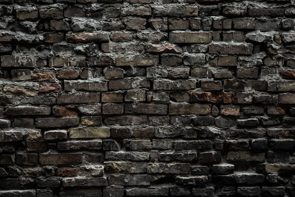 Urban black brick wall texture old masonry background. Gloomy background, black brick wall of dark stone texture — Stock Photo, Image