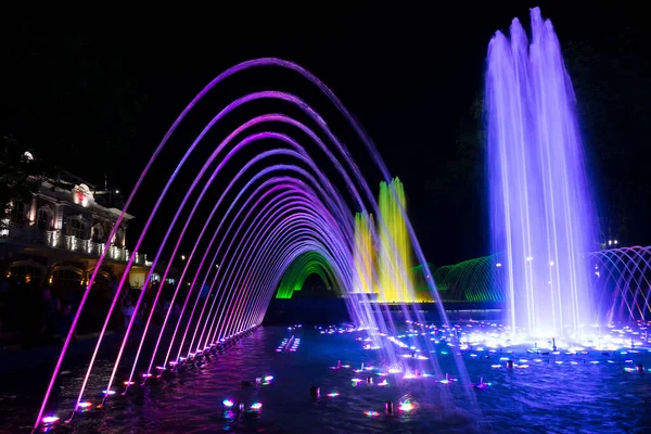 Fountains in the city. Colored night fountain, Krasnodar city, Russia