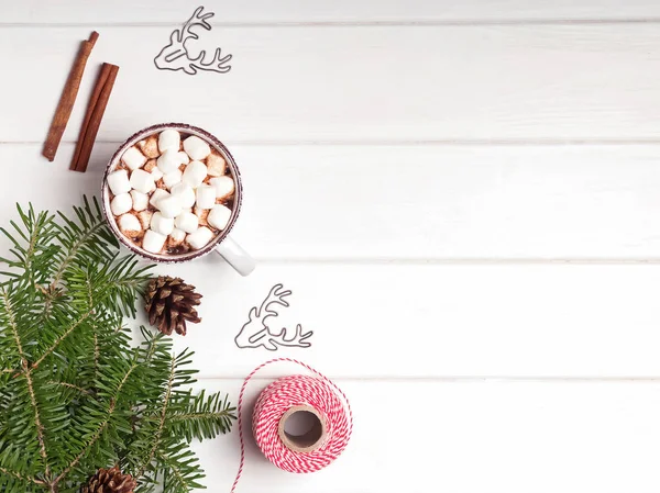 Hot chocolate, fir branches and Christmas gift on white background