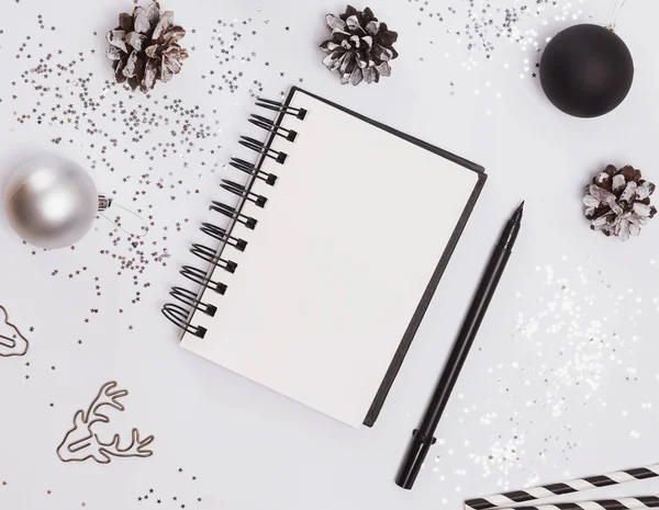 Blank notepad mock-up on the table with modern Christmas decor