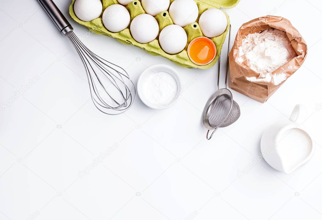 Baking ingredients on the white background, top view