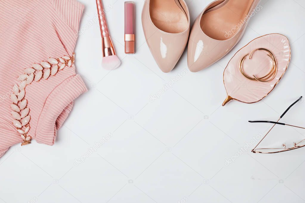 Outfit in beige and pale pink colors, top view