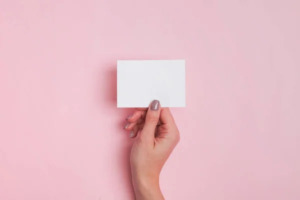 Womans hand holding blank paper card — 스톡 사진