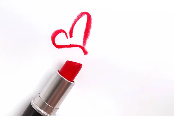Red lipstick and heart shaped trace isolated on white — Stock Photo, Image