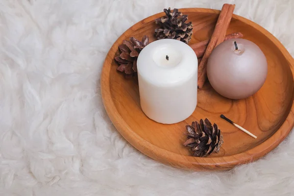 Pine cones and candles on the wooden tray — Stock Photo, Image